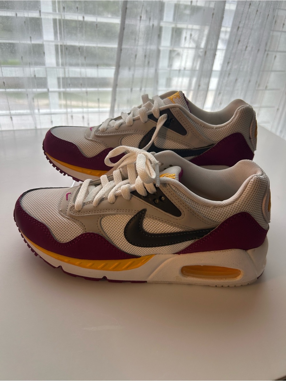 Nike White Sneakers with Purple, Yellow and Black Accents